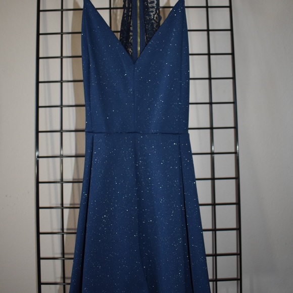 Blue sparkly romper S/M. No defects. . Worn 1 time for homecoming. - Picture 1 of 2
